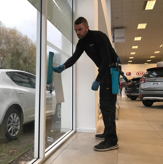 Andy cleaning a window